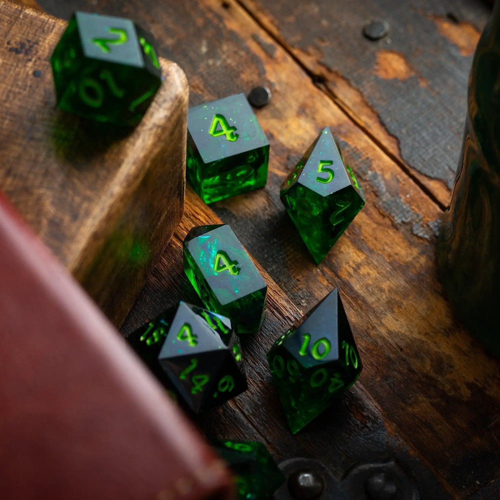 Nox Green handmade resin DND dice set by Runic Dice, featuring five intricately crafted polyhedral dice with a green and black swirl design.