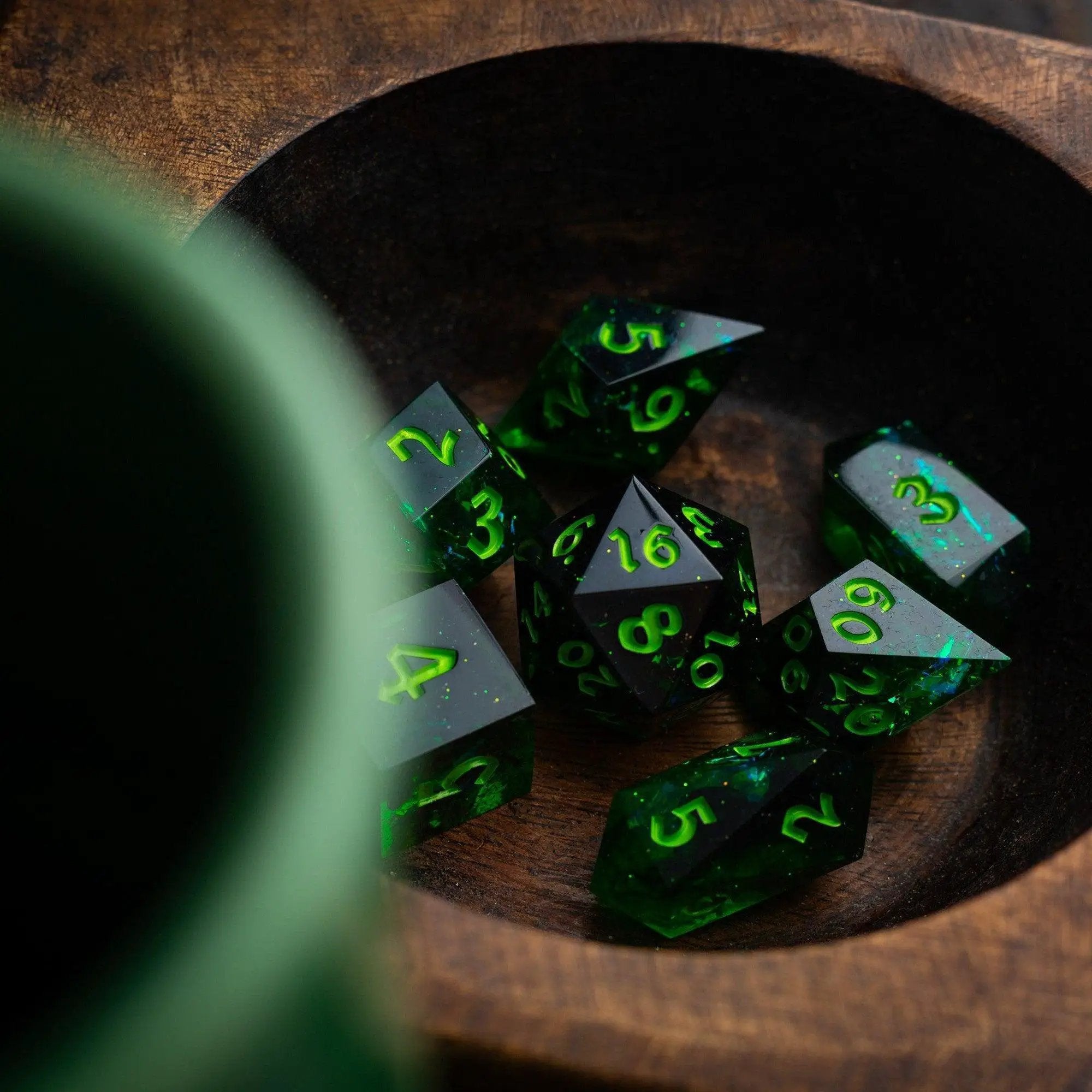 Nox Green handmade resin DND dice set by Runic Dice, featuring vibrant green and black swirling patterns for tabletop gaming.