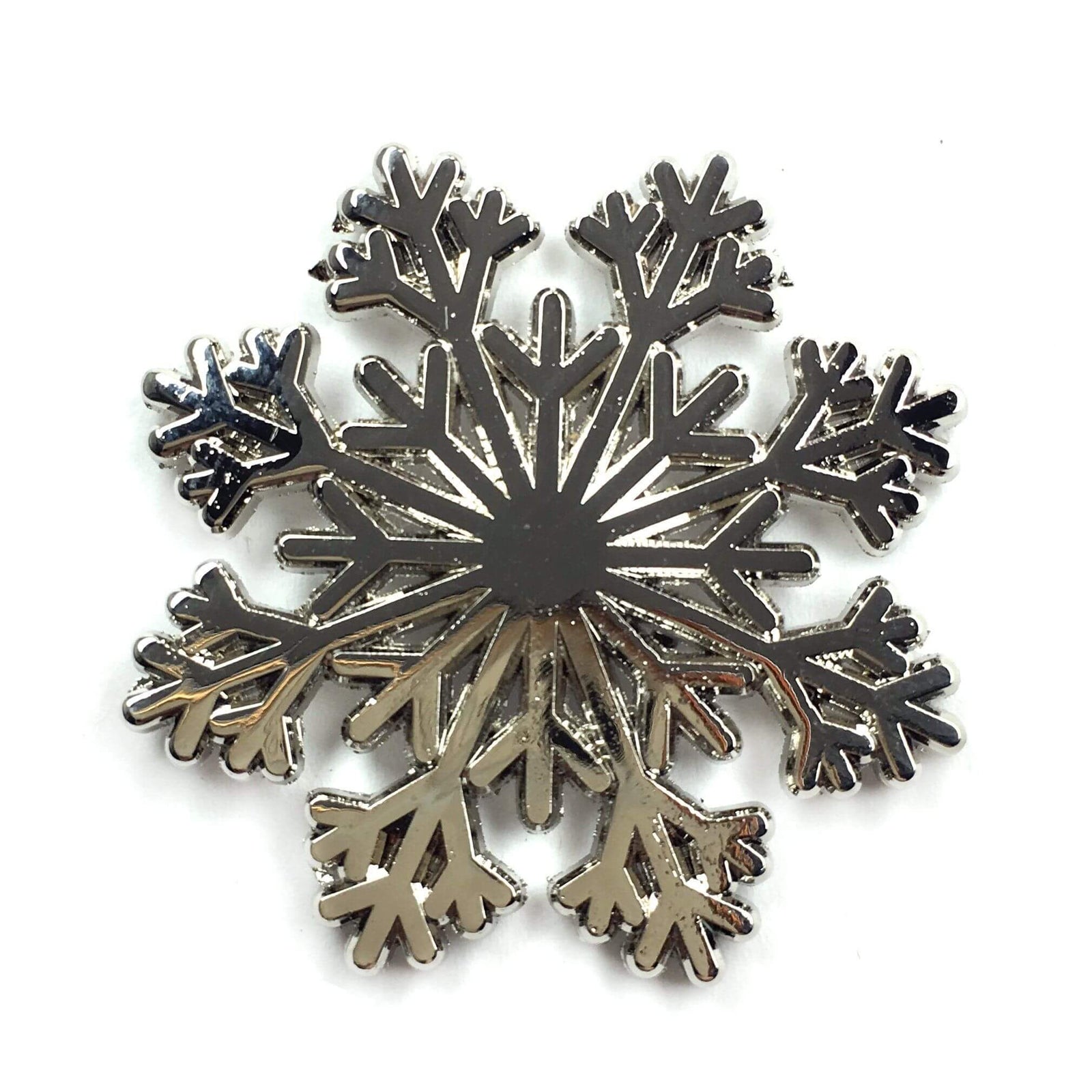 Kolorspun snowflake pin, an enamel pin with a detailed snowflake design, perfect for accessories and collectible jewelry.