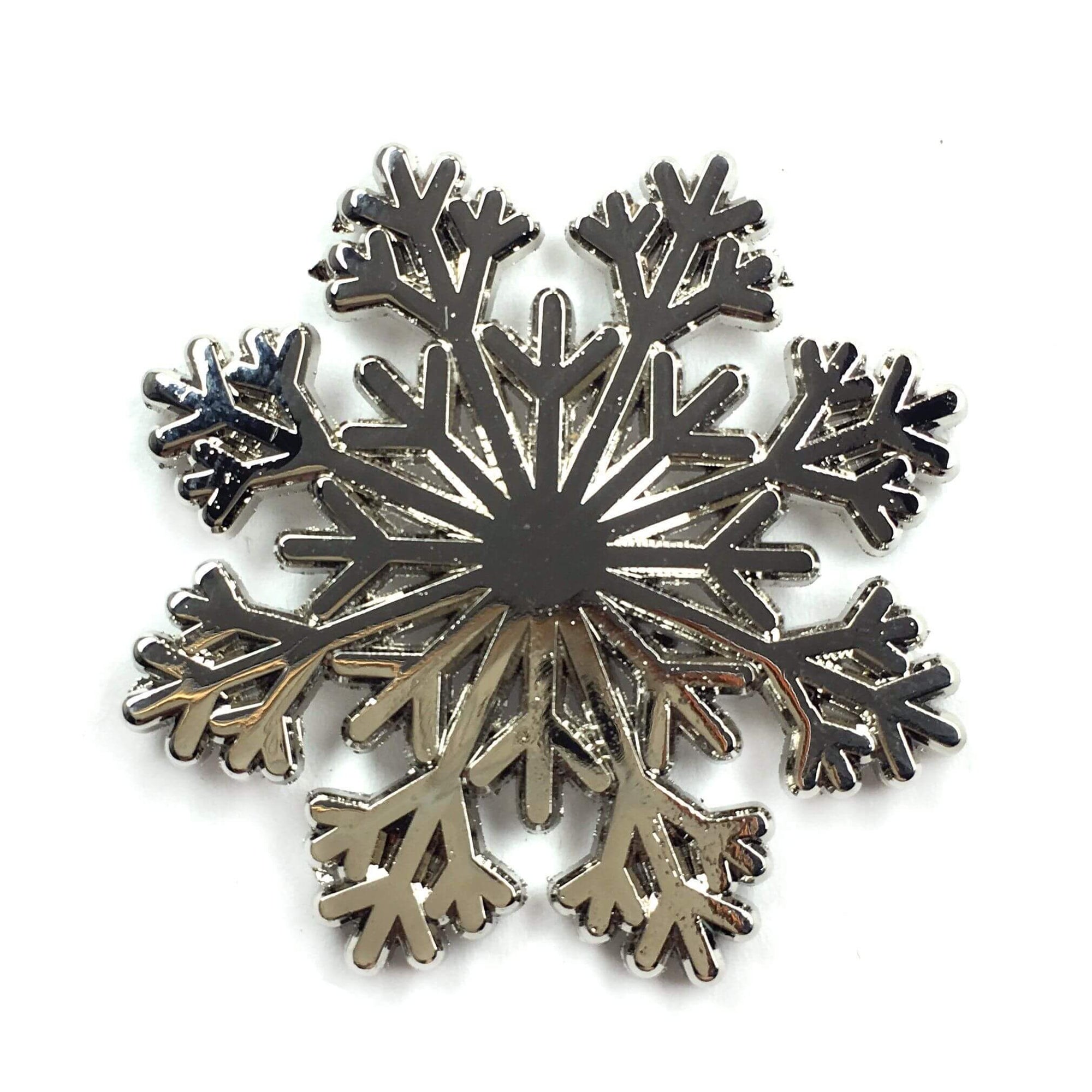 Kolorspun snowflake pin, an enamel pin with a detailed snowflake design, perfect for accessories and collectible jewelry.