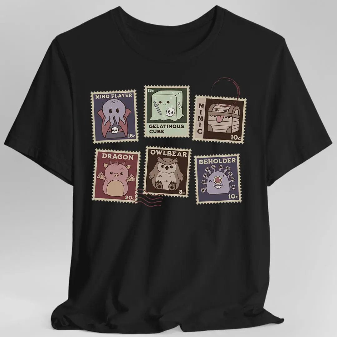 Black D&D Monster Stamps T-Shirt by Sunburst RPG featuring colorful monster illustrations on the front.