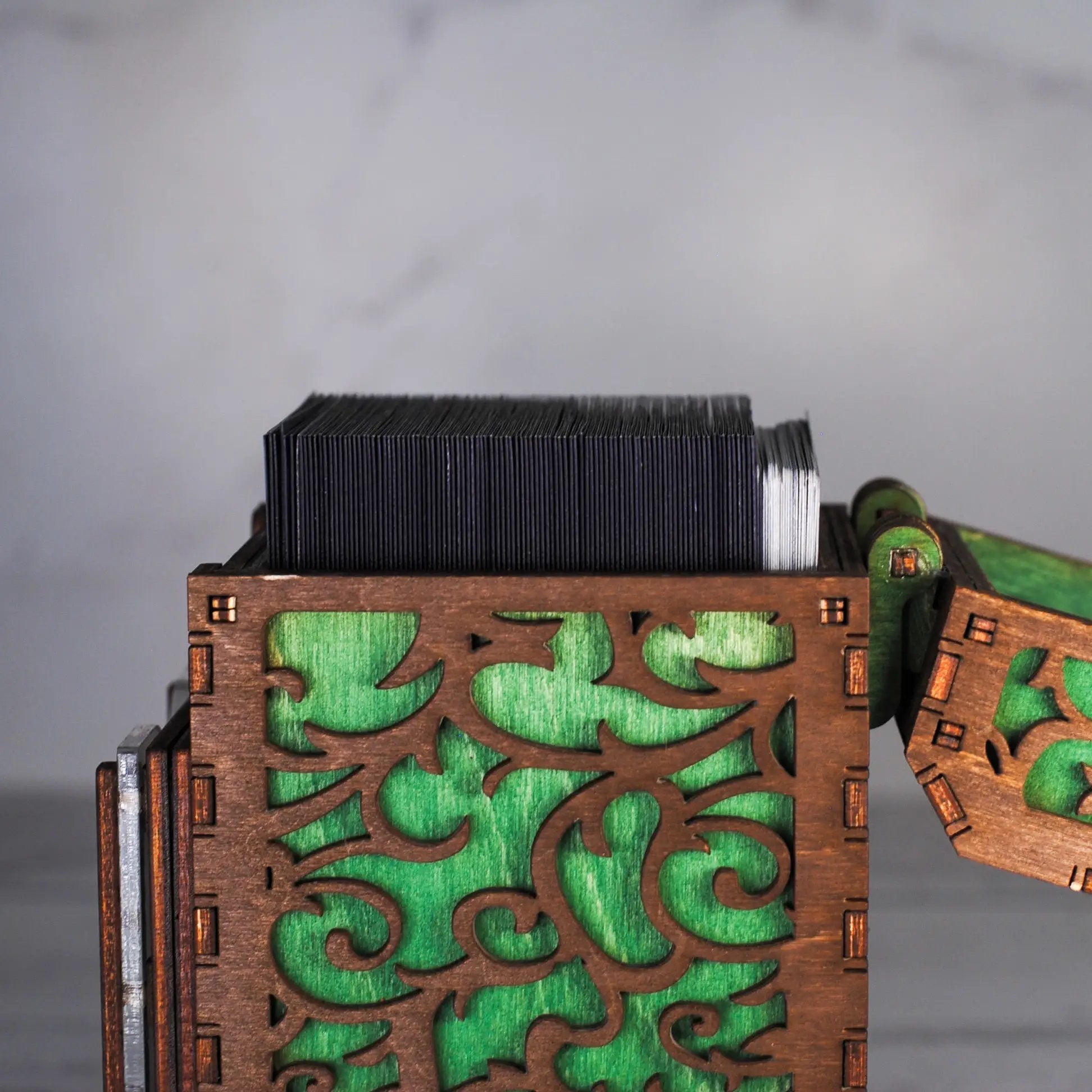 Black Talon & Claw Commander Deck Box with secure lid and card storage compartments for tabletop gaming.