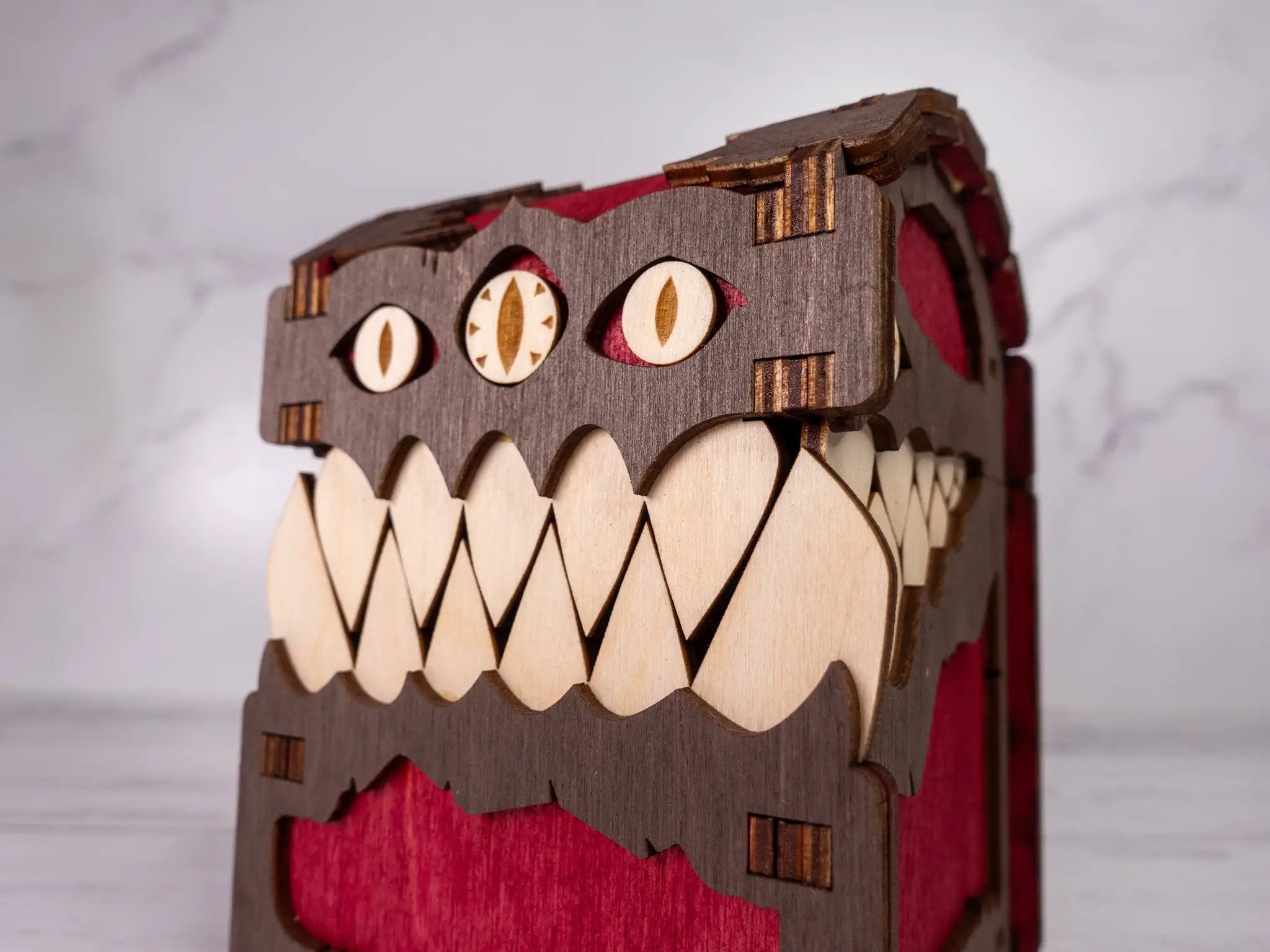 Black Mimic Chest Deck Box by Talon & Claw, featuring a detailed mimic creature design for card storage.