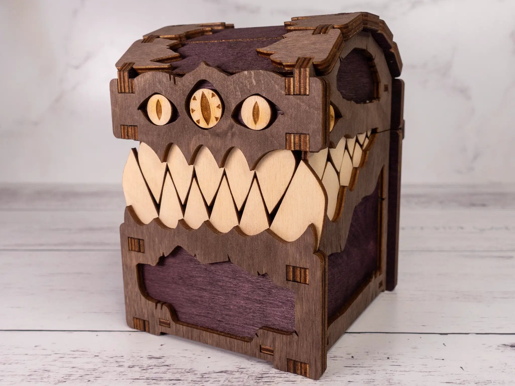 Black Mimic Chest Deck Box by Talon & Claw, with detailed mimic design, sturdy construction, and secure lid for trading card storage.