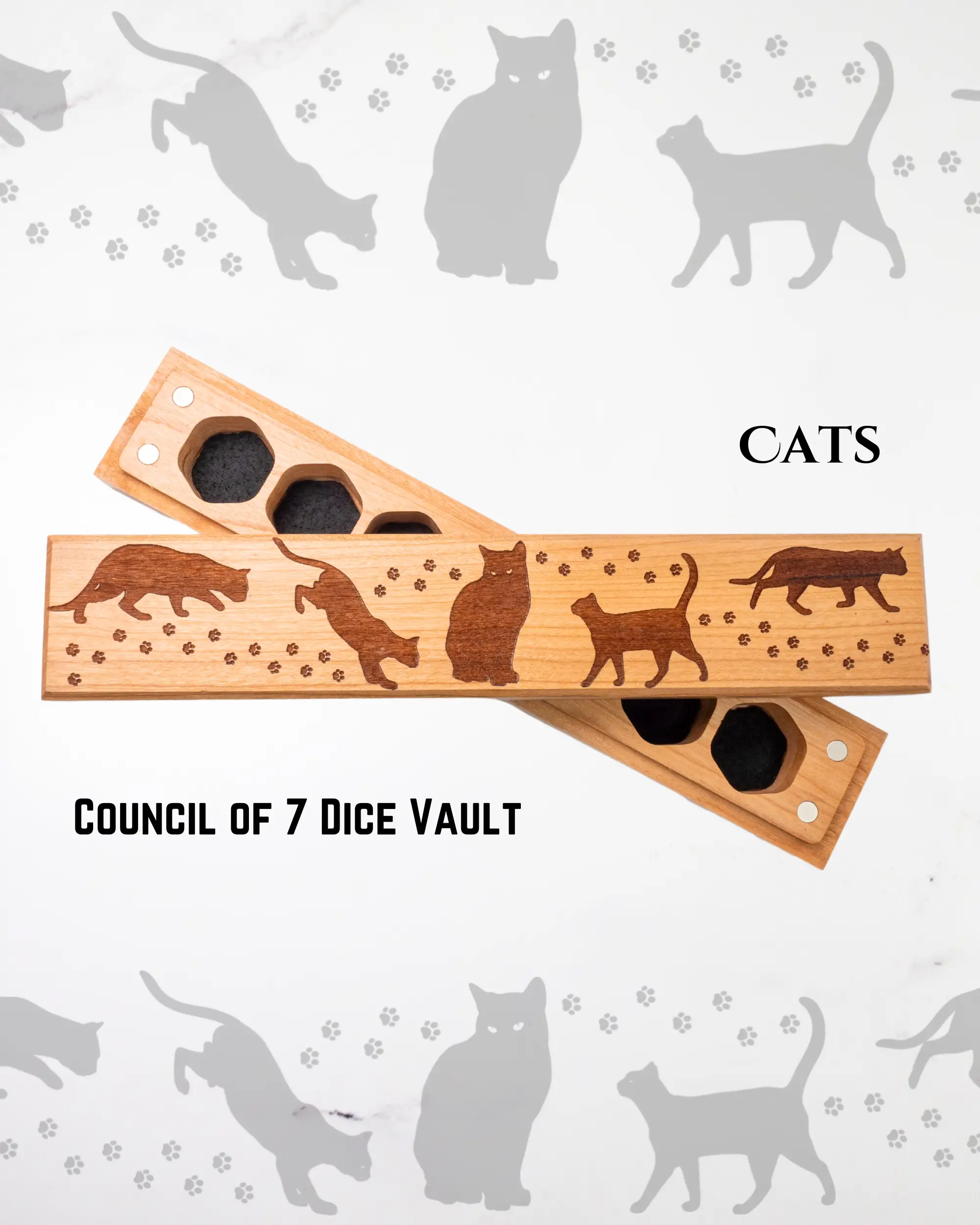 Cherry wood dice vault with engraved cats design by Talon & Claw, holds a set of seven engraved council of 7 dice.