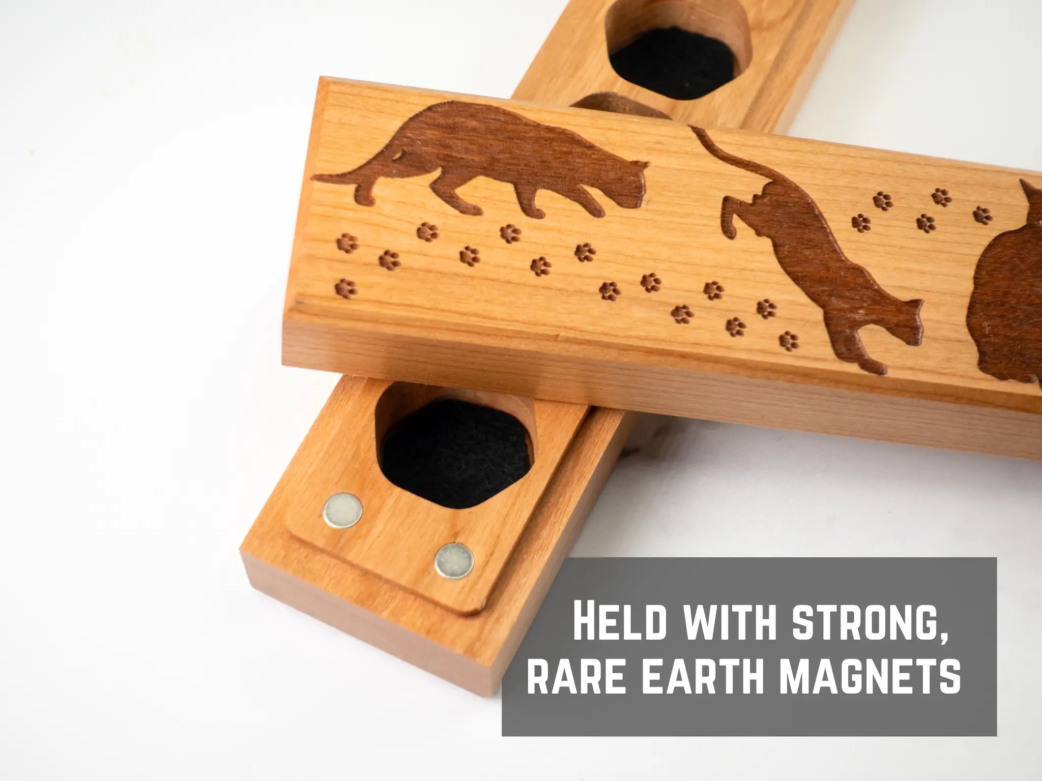 Cherry wood dice vault engraved with cats, designed by Talon & Claw for storing the Council of 7 dice, with a detailed feline motif.