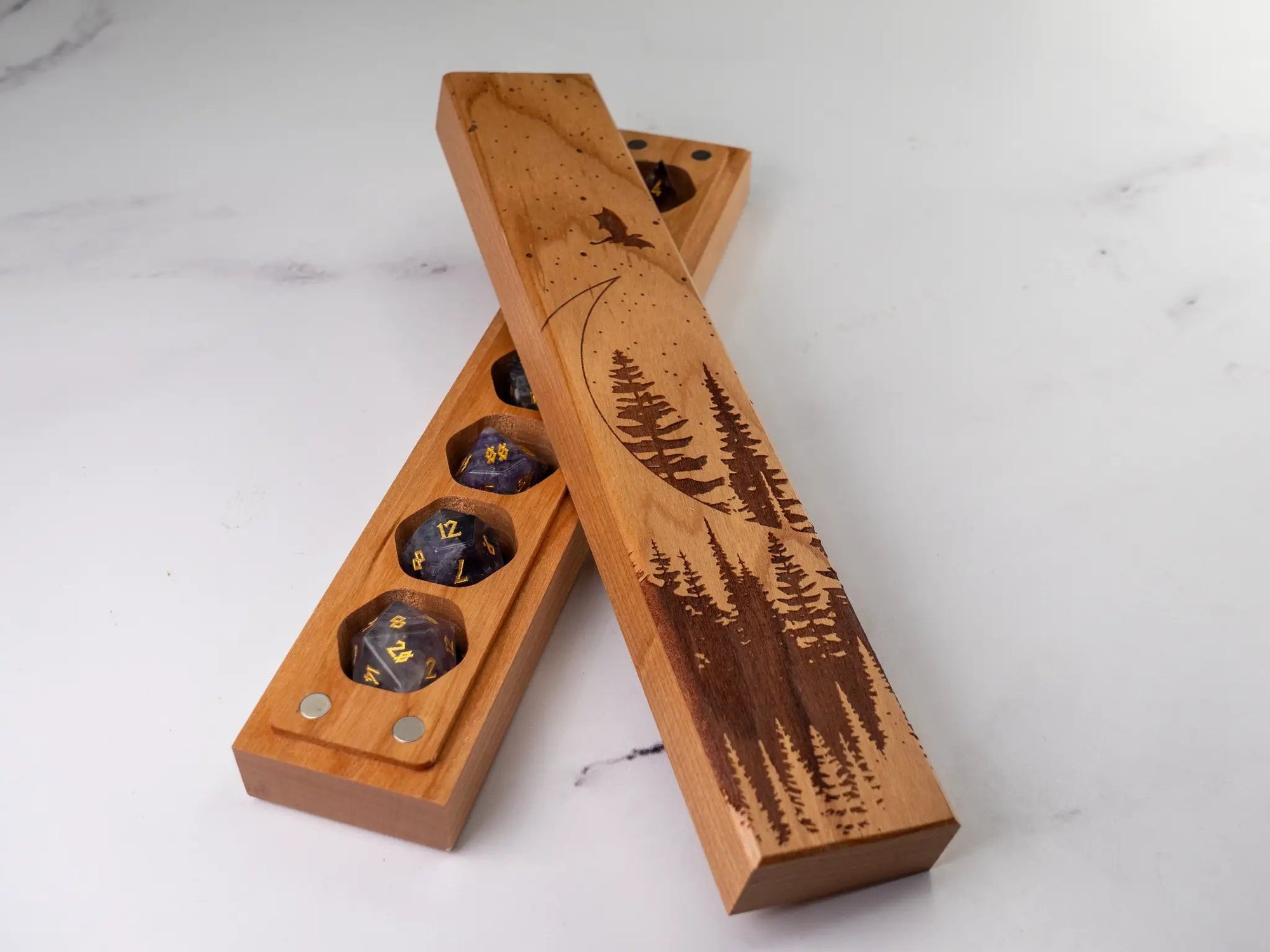 Cherry wood Dragon Moon engraved dice vault by Talon & Claw, designed to securely store a set of seven dice.