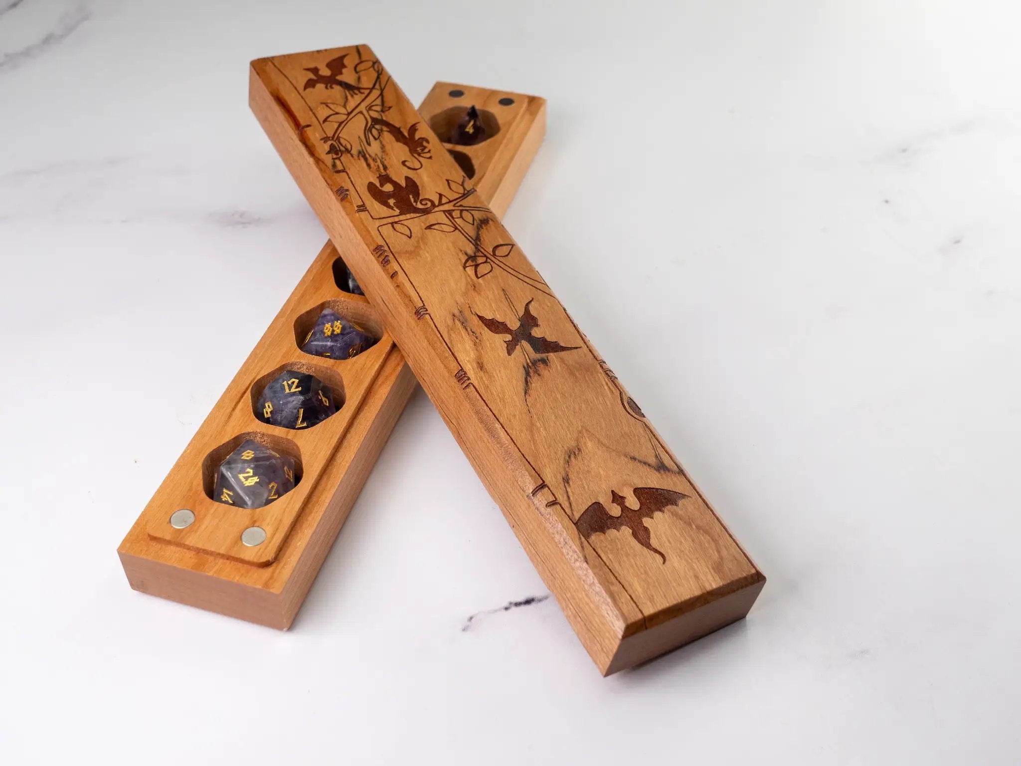 Cherry wood Dragon Tree engraved dice vault by Talon & Claw, designed to securely store a set of seven engraved dice.
