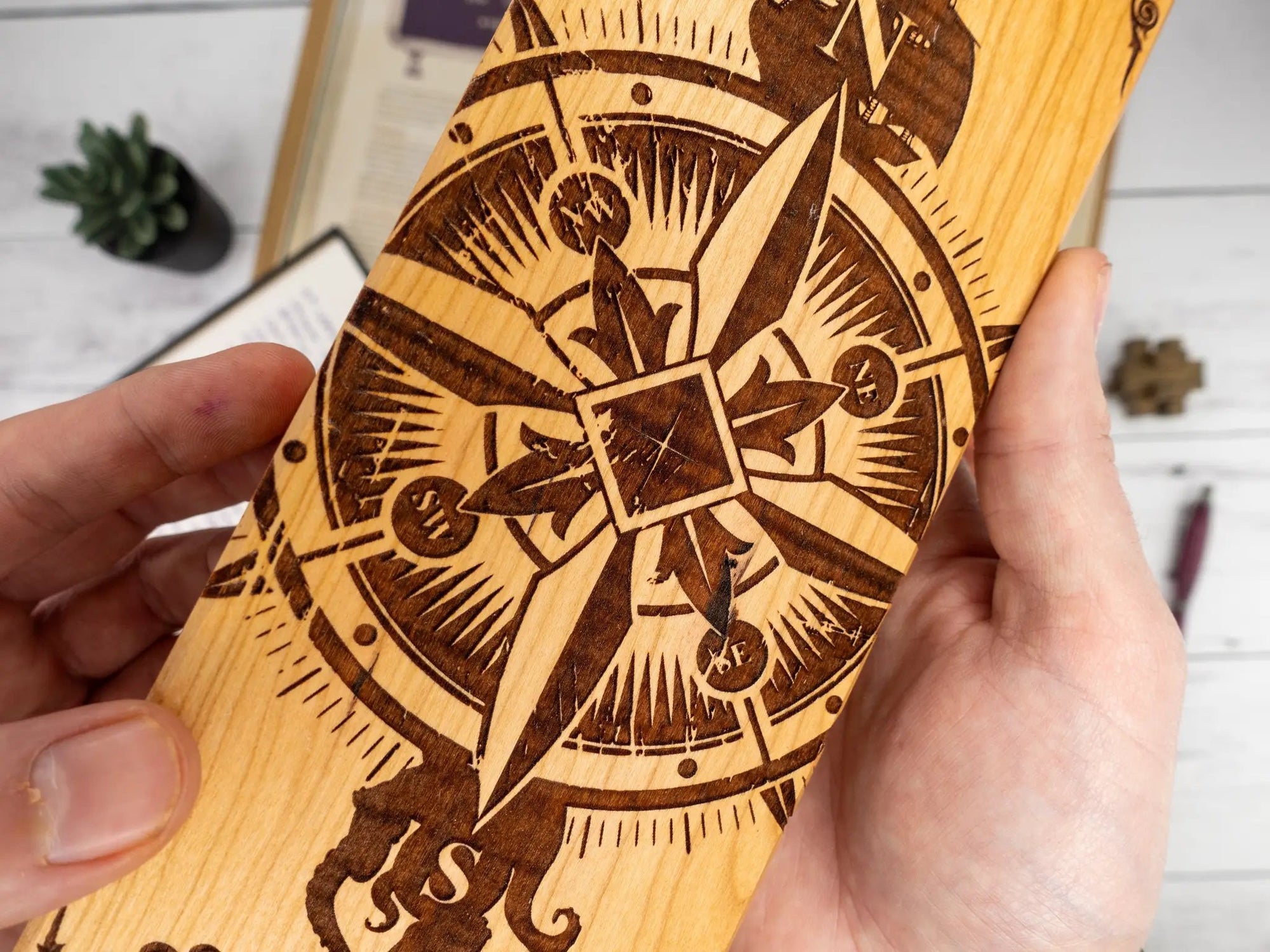 Talon & Claw Compass Adventure engraved dual hex dice vault made of purpleheart wood with compass design.