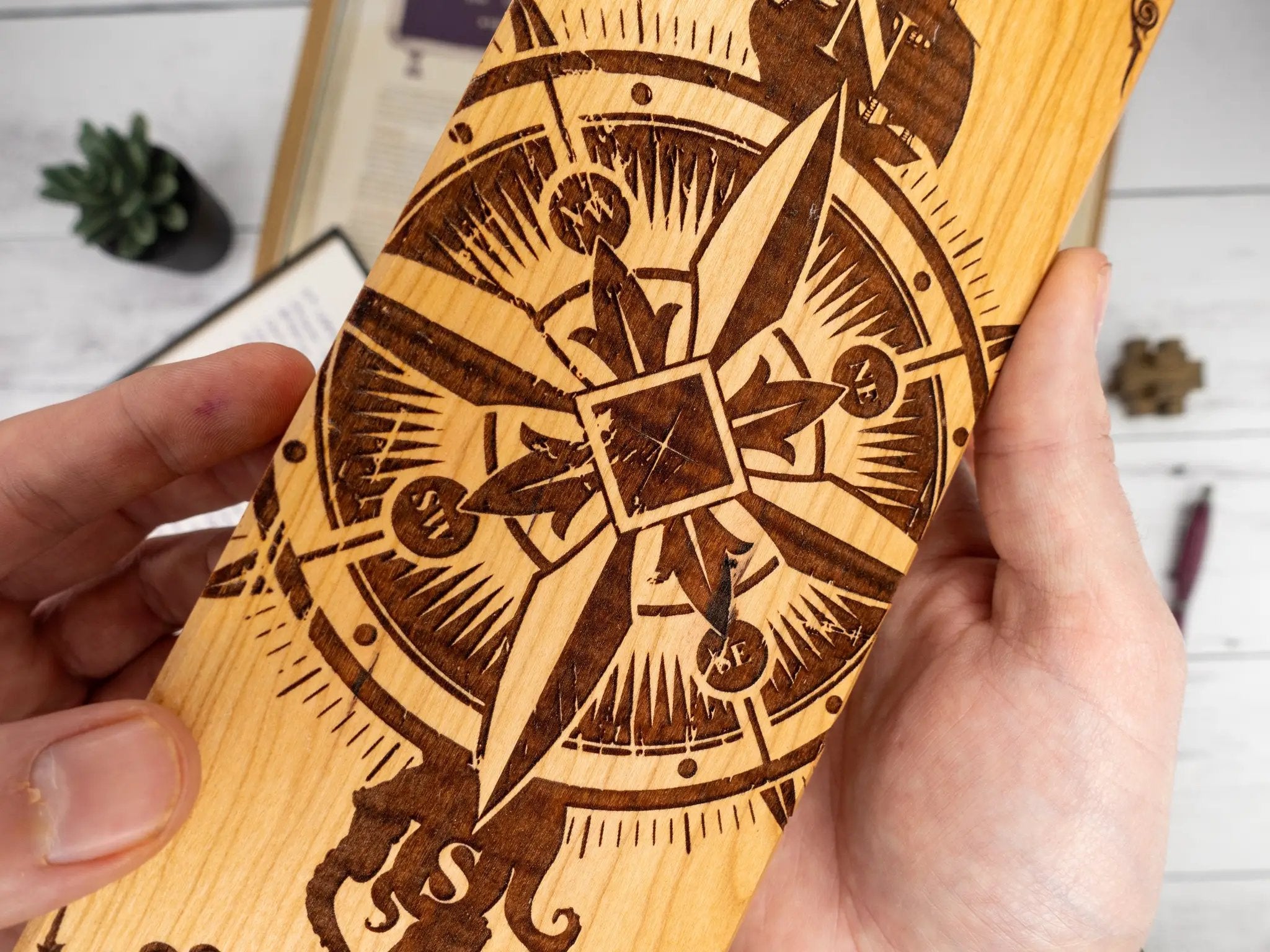Talon & Claw Compass Adventure engraved dual hex dice vault made of purpleheart wood with compass design.