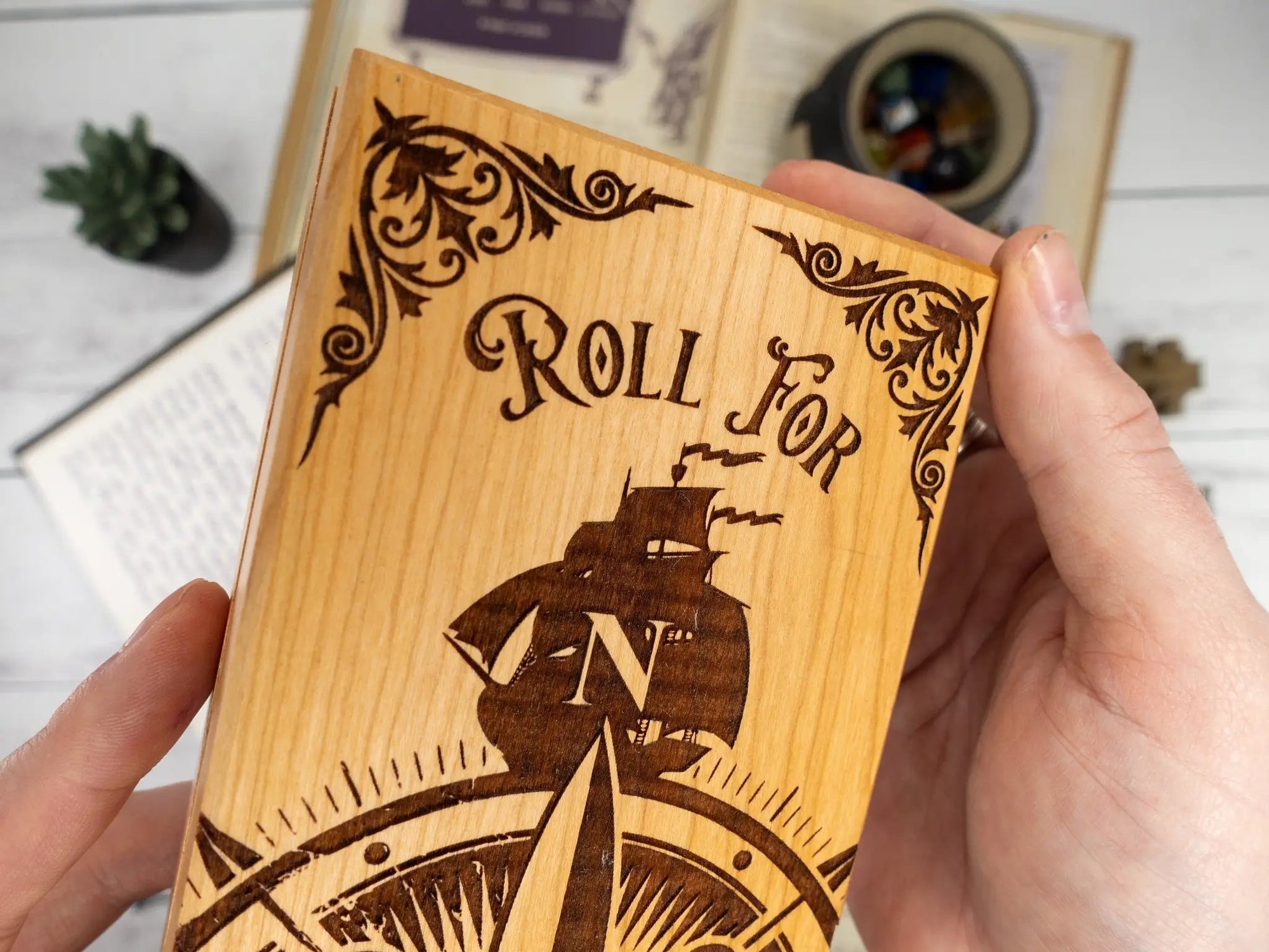 Talon & Claw Compass Adventure engraved dual hex dice vault made of purpleheart wood with compass design.