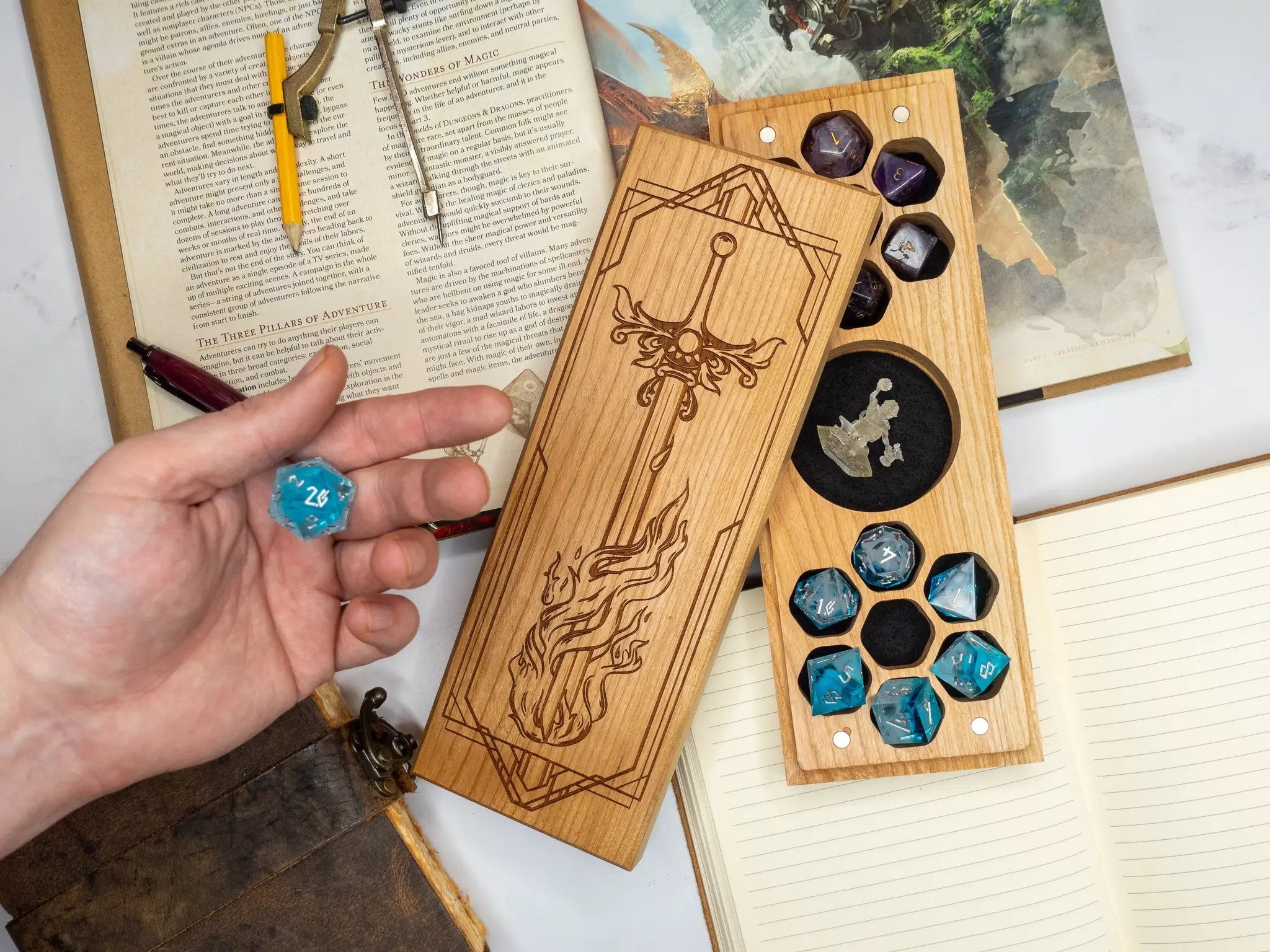 Purpleheart dice vault with flaming sword design from Talon & Claw, featuring a dual hex shape for storing gaming dice.
