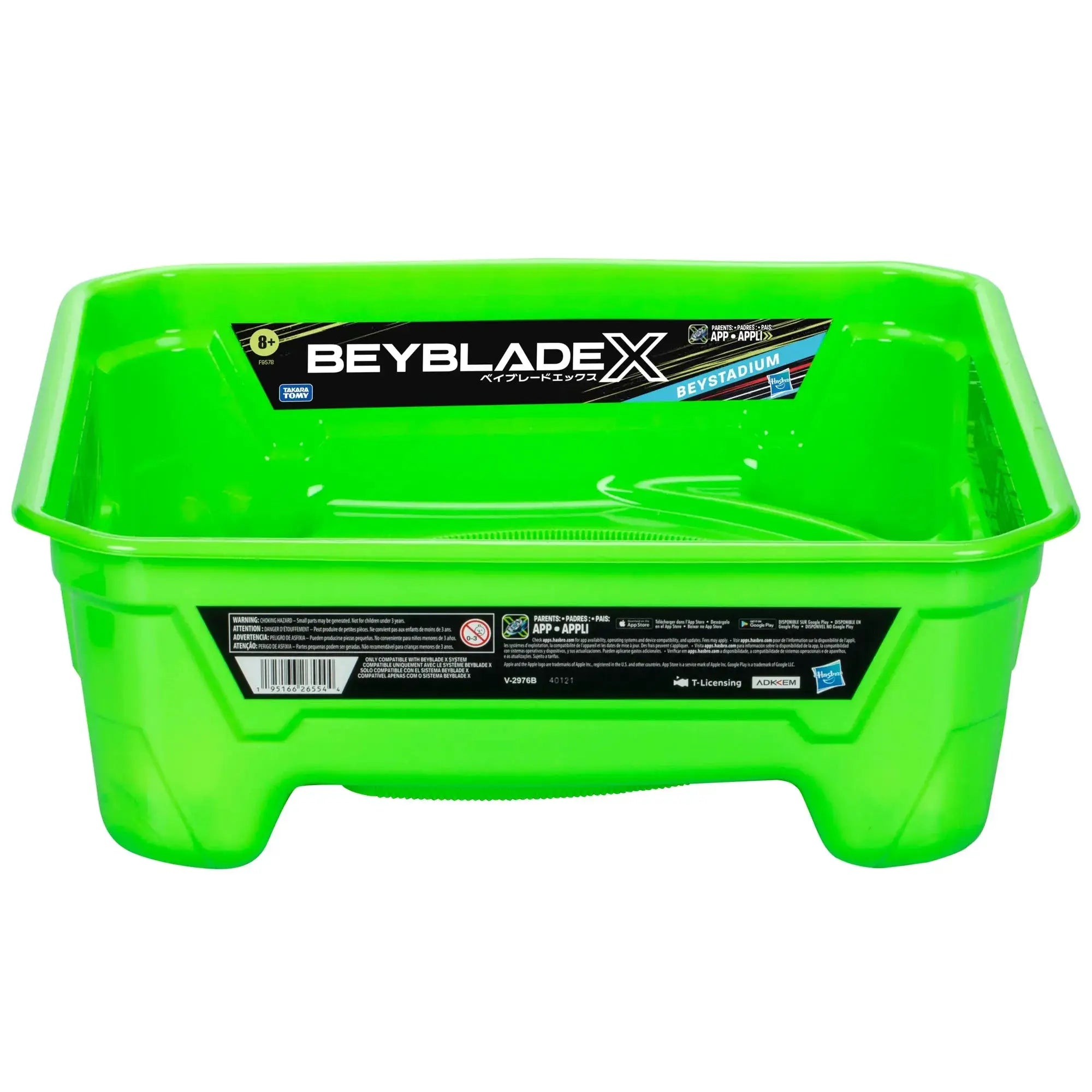 Green Beyblade X Beystadium battle arena for spinning top toys, designed for Beyblade battles, with space for tops and launchers.