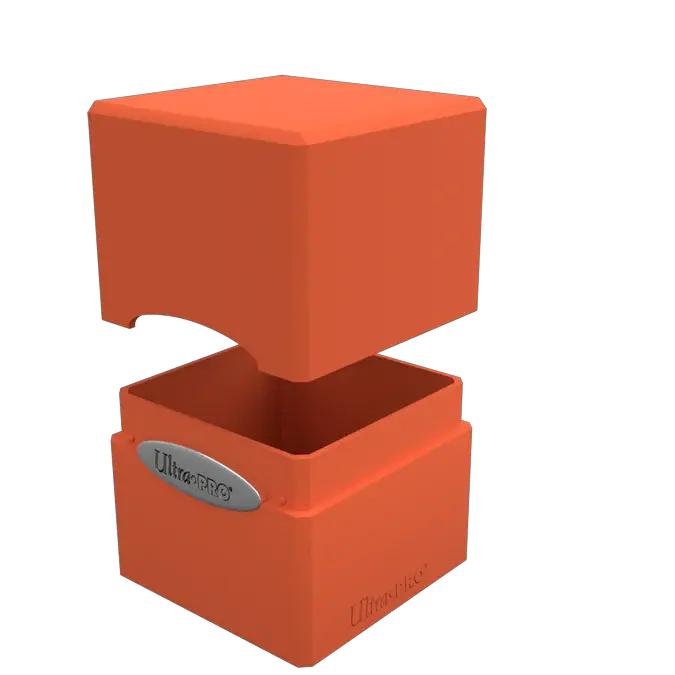 Orange satin cube puzzle from THE MIGHTY HOBBY SHOP, featuring smooth, glossy surface and geometric shape on a plain background.