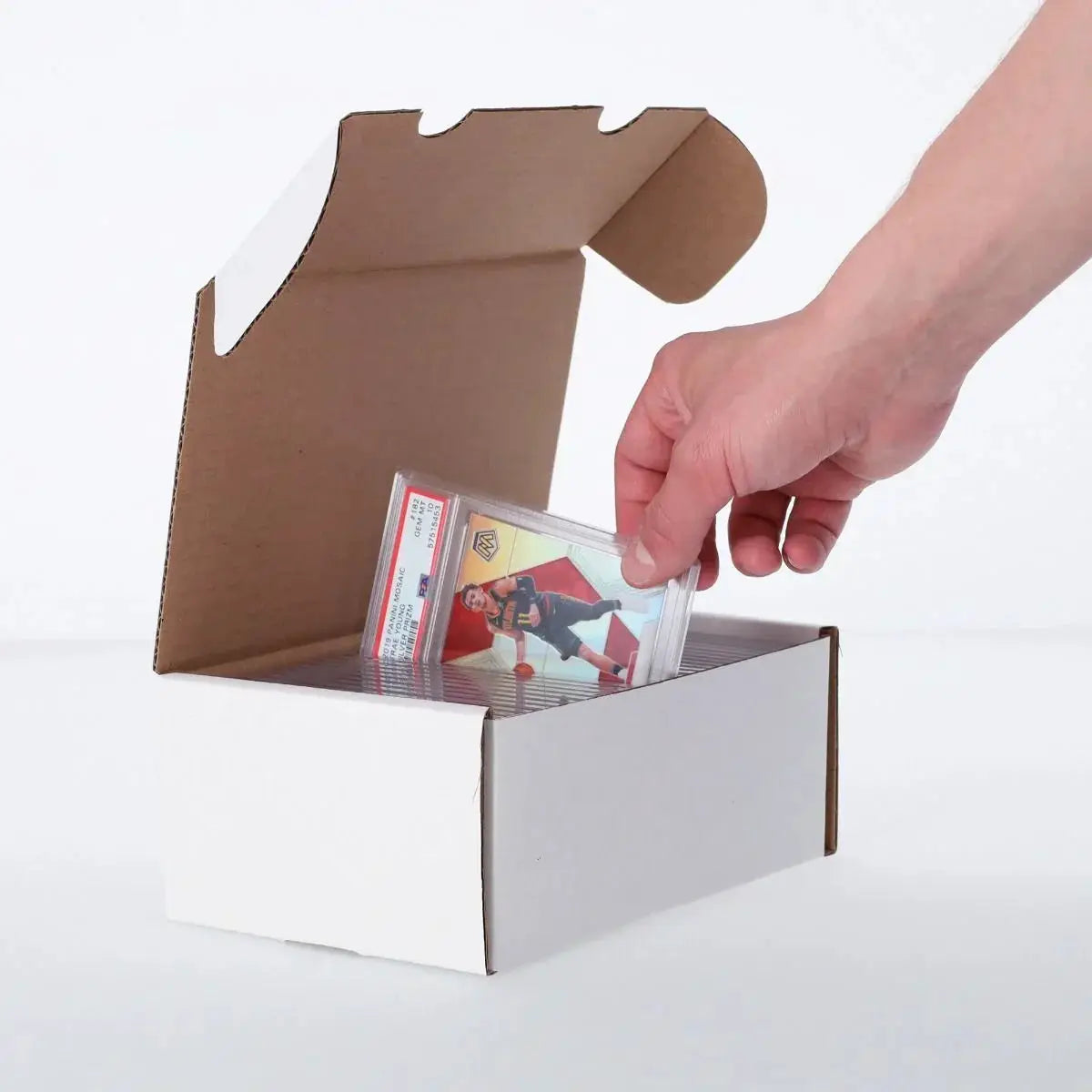 Graded trading card box from THE MIGHTY HOBBY SHOP with a hand holding the open box, showcasing storage for collectible cards.