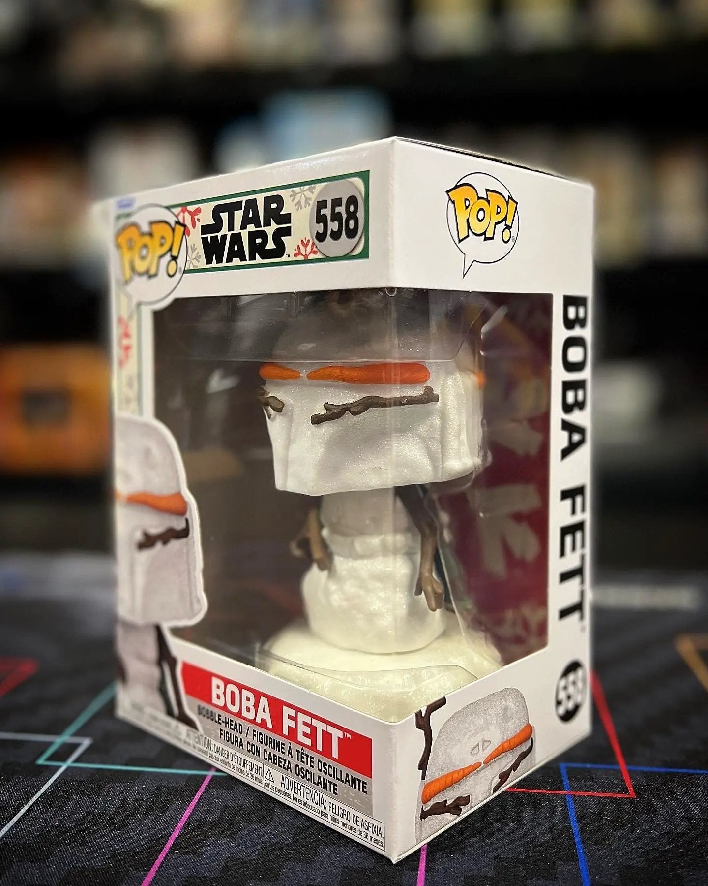 Pop! Star Wars Boba Fett Holiday figure from THE MIGHTY HOBBY SHOP, featuring Boba Fett in festive holiday attire with detailed costume.