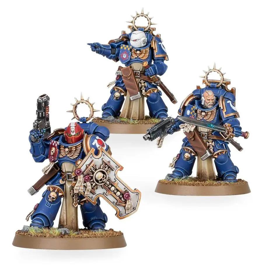 Ultramarines Space Marines Bladeguard Veteran Squad miniatures from THE MIGHTY HOBBY SHOP, featuring detailed armor and weaponry.