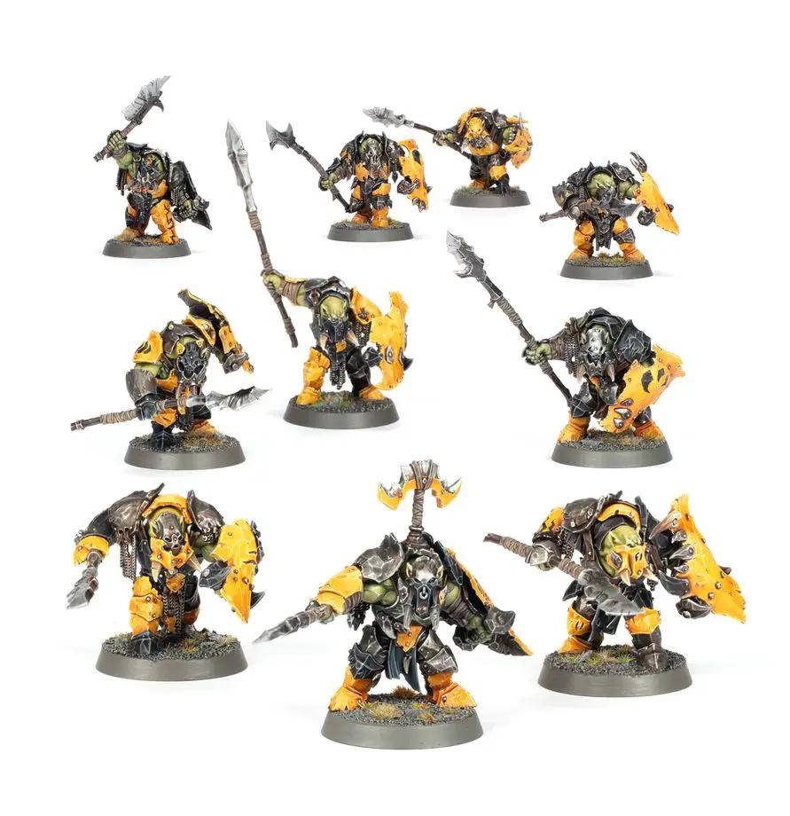 Warhammer Age of Sigmar Ardboyz miniature set featuring orc warriors with green skin and weapons, painted in vibrant colors.