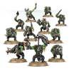 Warhammer Orks Boyz miniature by THE MIGHTY HOBBY SHOP, showing green-skinned Ork soldiers with weapons and armor.