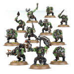 Warhammer Orks Boyz miniature by THE MIGHTY HOBBY SHOP, showing green-skinned Ork soldiers with weapons and armor.