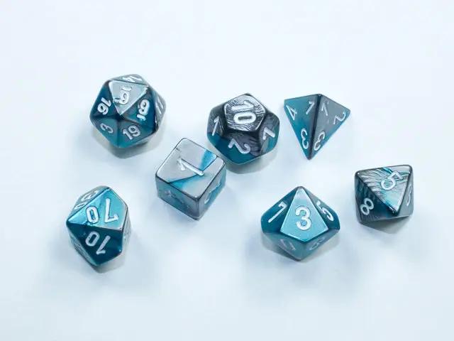Mini 7-die set from Chessex featuring colorful polyhedral dice for tabletop gaming, displayed on a flat surface.