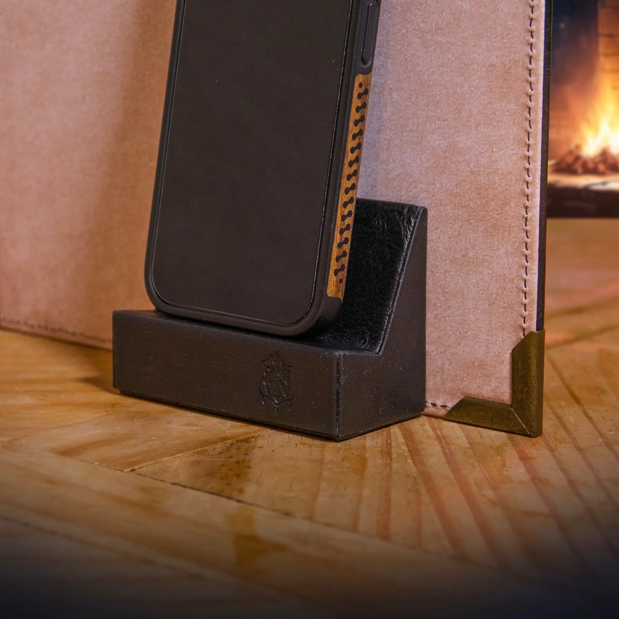 Brown magnetic phone holder by The Ultimate Game Master, designed for digital tools mount on game master screens during TTRPG sessions.