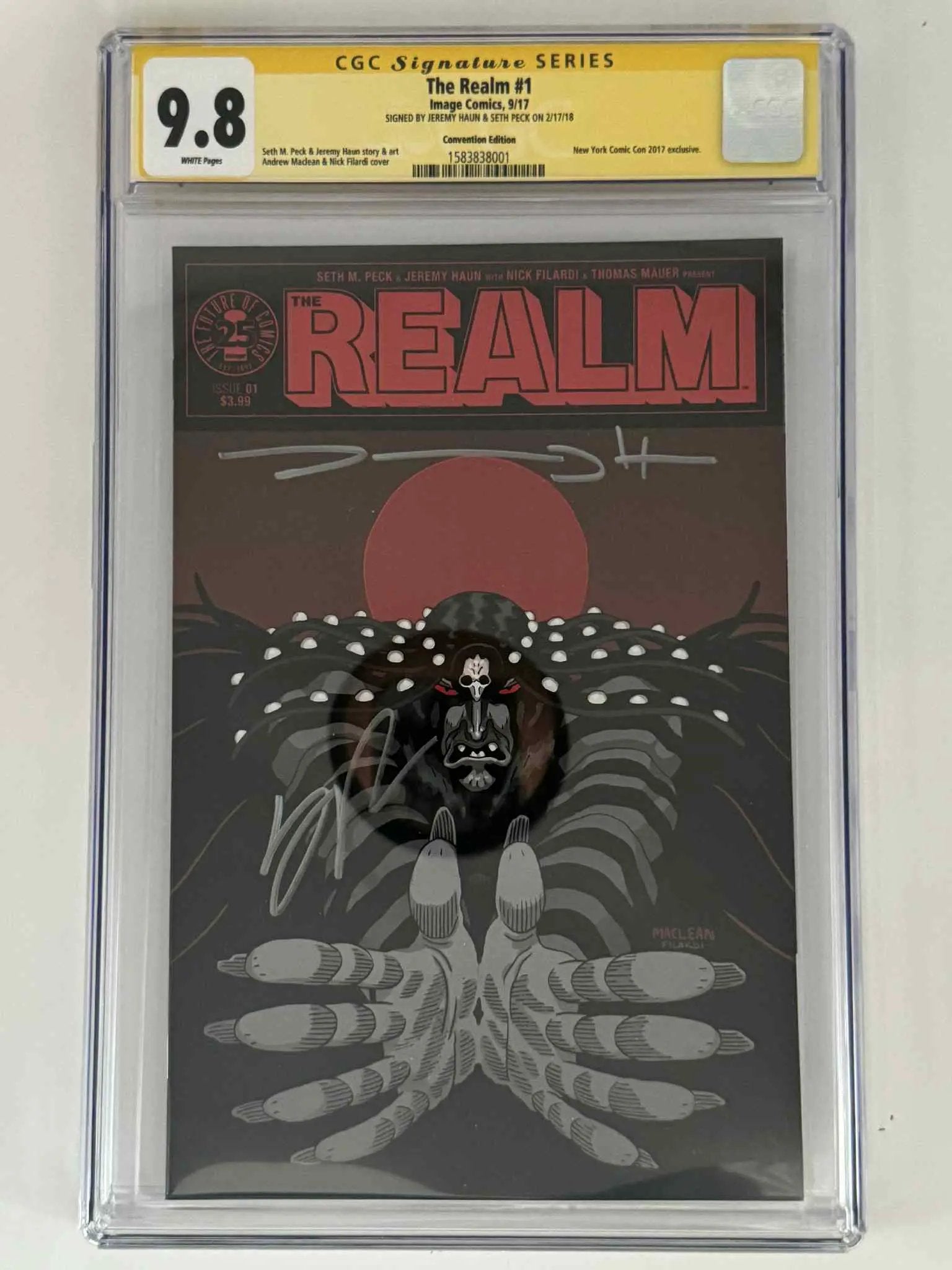 Double signed comic book The Realm #1 CGC 9.8 yellow label by Jeremy Haun and Seth Peck, featuring Andrew Maclean and Nick Filardi variant art.